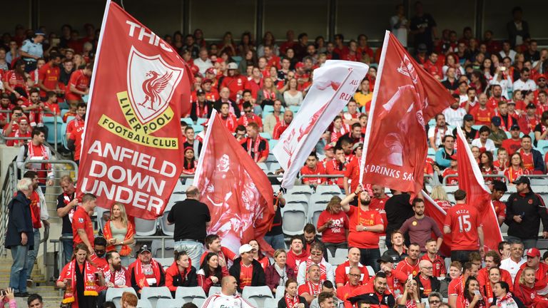 Liverpool fans hold up banners before the start of Liverpool Legends friendly against Australian Legends at the ANZ Stadium in Sydney