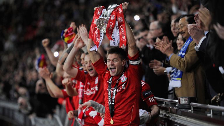 Steven Gerrard lifts the trophy in victory after the Carling Cup Final match between Liverpool and Cardiff