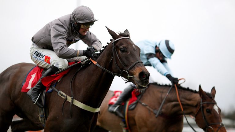 Nico de Boinville and Local Show (left) just get the better of the lunging Onenightinvienna to win the racinguk.com/anywhere Novices' Chase at Kempton Park