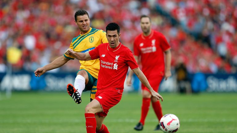 Jason Culina (left) competes with Luis Garcia (right) during the match between Liverpool FC Legends and the Australian Legends
