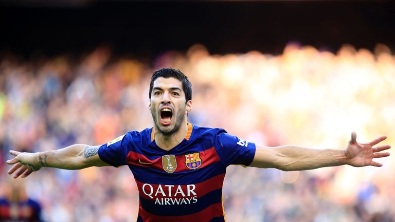 Barcelona forward Luis Suarez celebrates after scoring against Atletico Madrid