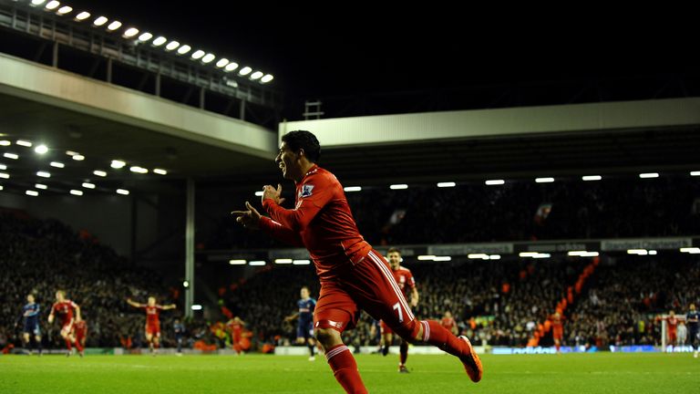 Liverpool's Urugyan forward Luis Suarez celebrates scoring on his debut during their English Premier League football match against Stoke City at Anfield