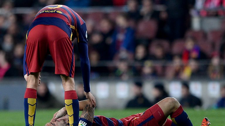 Luis Suarez lies on the floor after a collision with Xabier Etxeita.