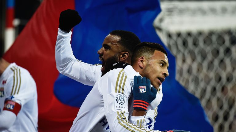 Lyon's French midfielder Coretin Tolisso (R) celebrates with his teammate Lyon's French forward Alexandre Lacazette (L) 