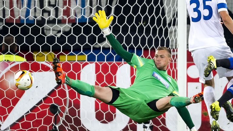 Lech Poznan's Polish goalkeeper Maciej Gostomski concedes a goal during a UEFA Europa League match (Credit FABRICE COFFRINI/AFP/Getty Images)