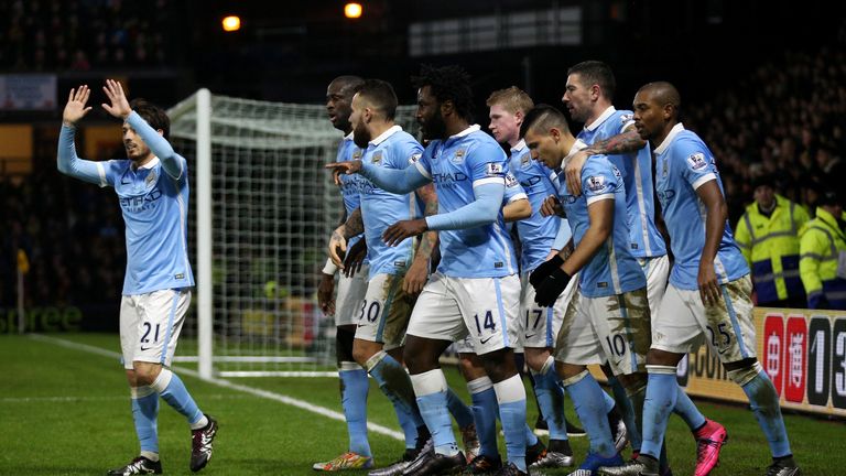 Sergio Aguero of Manchester City (3R) celebrates with his team mates