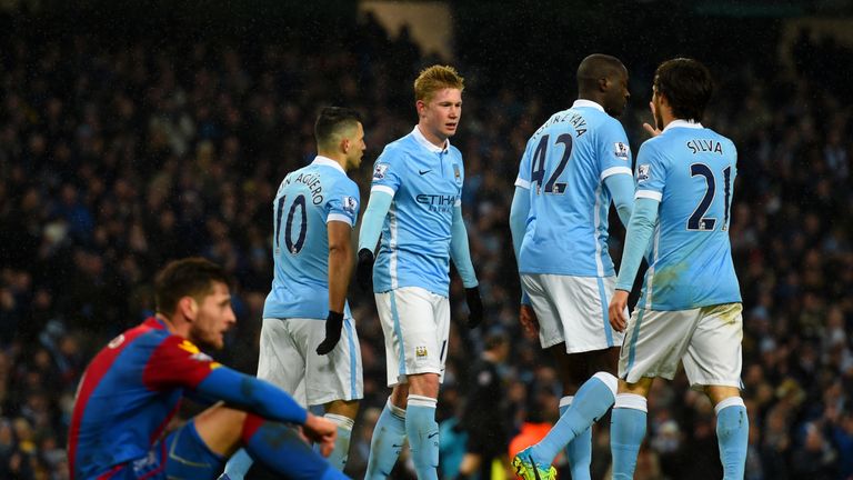 Sergio Aguero of Manchester City celebrates with team-mates after scoring his team's third goal