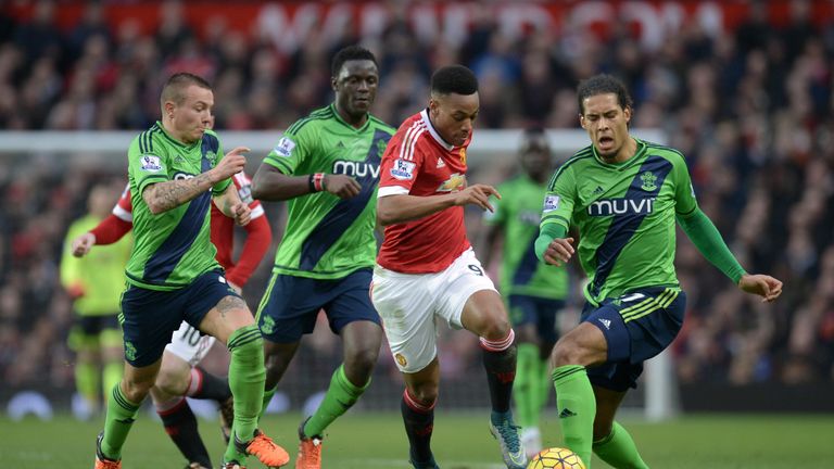 Manchester United's Anthony Martial (centre) is chased by Southampton's Jordy Clasie (left) and  Virgil van Dijk (right) 