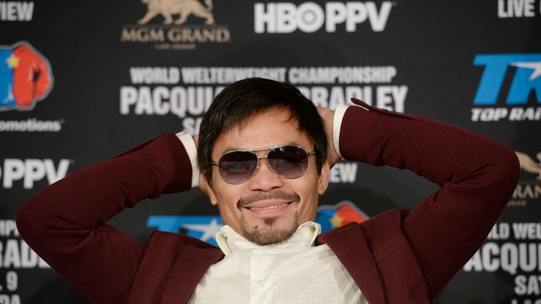 Manny Pacquaio relaxes during the press conference to announce his fight against Timothy Bradley