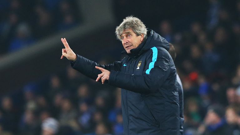 Manuel Pellegrini, manager of Manchester City gives instructions