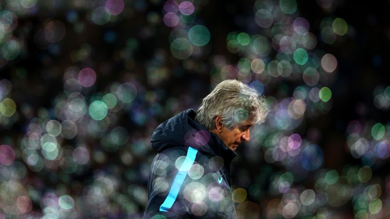 Manchester City manager Manuel Pellegrini looks despondent among the bubbles