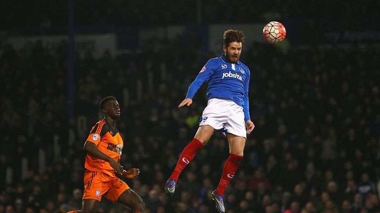Portsmouth's Marc McNulty heads home his side's second goal against Ipswich