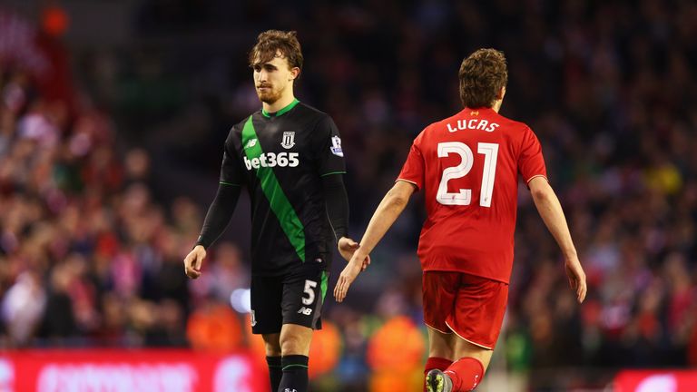 Marc Muniesa of Stoke City shake hands with Lucas Leiva of Liverpool 