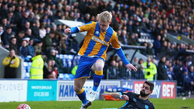 Jack Grimmer of Shrewsbury Town us tackled by Sheffield Wednesday's Marco Matias 