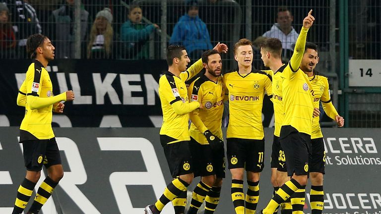 Marco Reus of Dortmund celebrates the first goal with his team mates against Borussia Monchengladbach