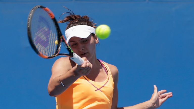 MELBOURNE, AUSTRALIA - JANUARY 18:  Margarita Gasparyan of Russia plays a backhand in her first round match against Sara Errani of Italy during day one of 