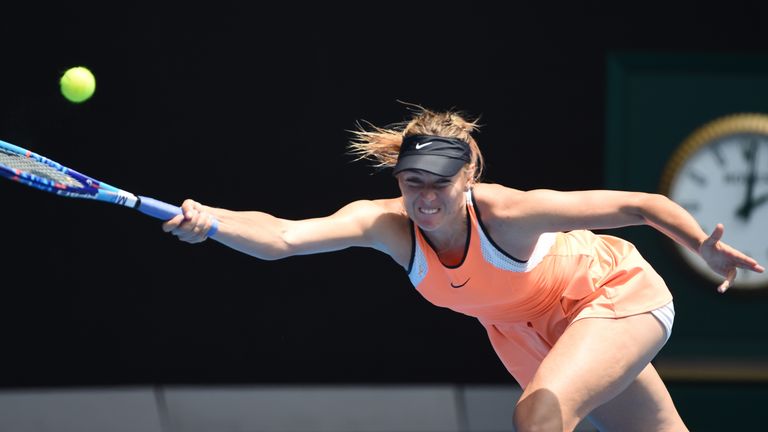 Maria Sharapova plays a forehand return