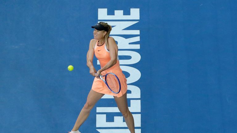 Maria Sharapova of Russia plays a forehand in her first round match against Nao Hibino of Japan during day one of the 2