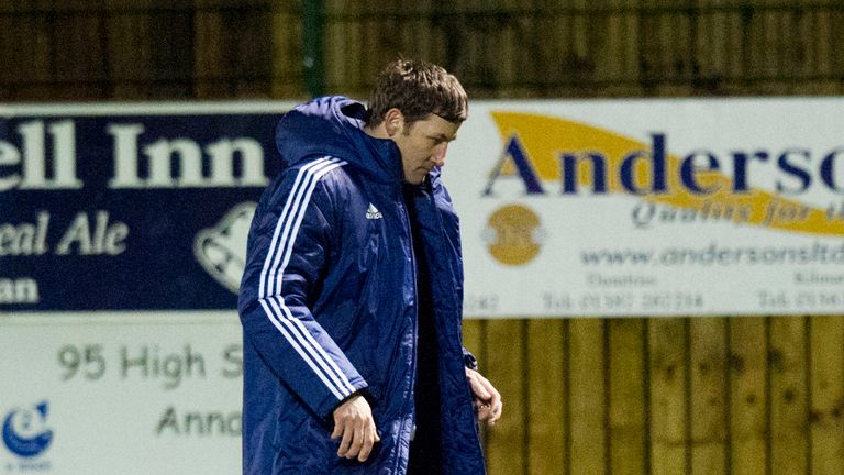 Hamilton manager Martin Canning trudges off the pitch as his side suffer defeat to Annan in Scottish Cup