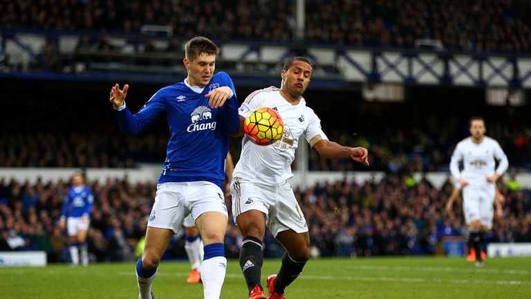 Martinez refused to pin blame solely on John Stones (left) for conceding a penalty against Swansea