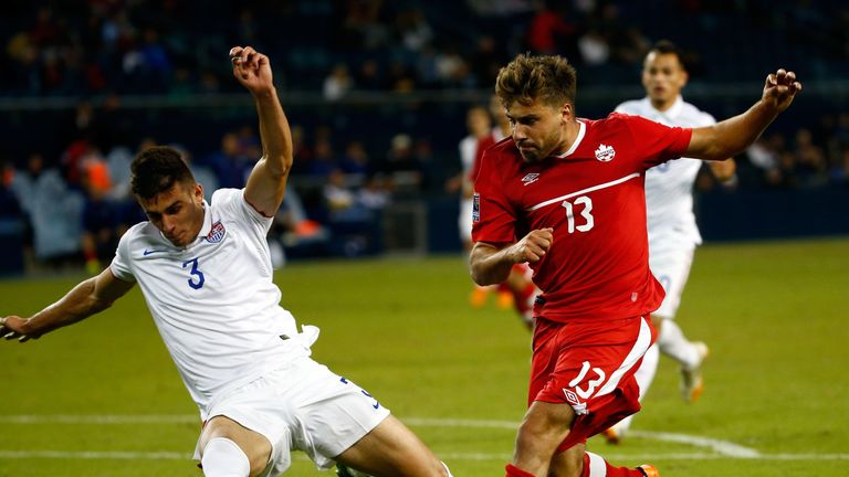 Michael Petrasso #13 of Canada and Matt Miazga #3 of the USA compete for the ball