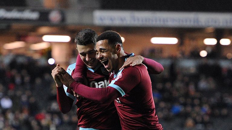 Burnley's Matthew Lowton celebrates with team-mate Andre Gray (right) after scoring the fourth goal v MK Dons