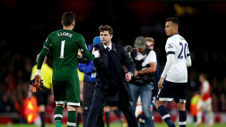 Mauricio Pochettino (centre) congratulates Hugo Lloris following Spurs' 1-1 draw at Arsenal
