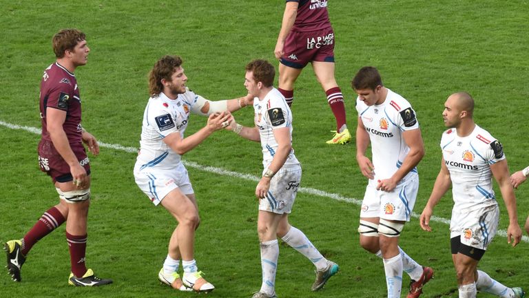 Max Bodilly is congratulated by his team-mates after scoring a try