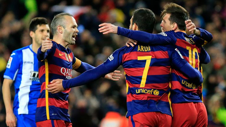 Lionel Messi (r) celebrates his equaliser with Arda Turan (C) and Andres Iniesta (l)