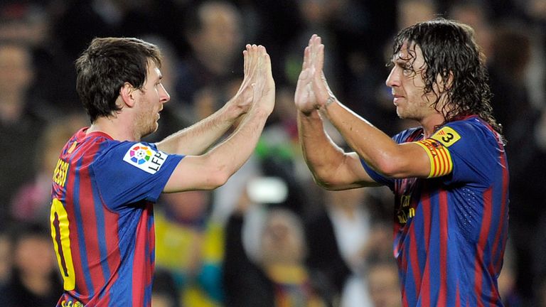 Barcelona's Argentinian forward Lionel Messi celebrates with Barcelona's captain Carles Puyol (R) after scoring against Zaragoza during their Spanish leagu