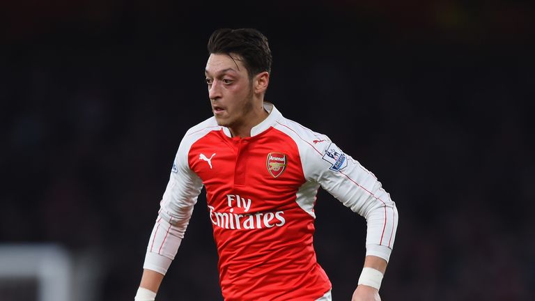 Mesut Oezil of Arsenal runs with the ball during the Premier League match against Chelsea at Emirates Stadium