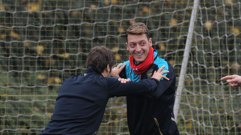 Mathieu Flamini and Mesut Ozil of Arsenal during a training session