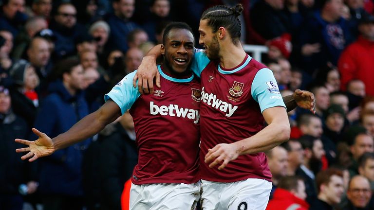 Michail Antonio celebrates with Andy Carroll after scoring against Liverpool