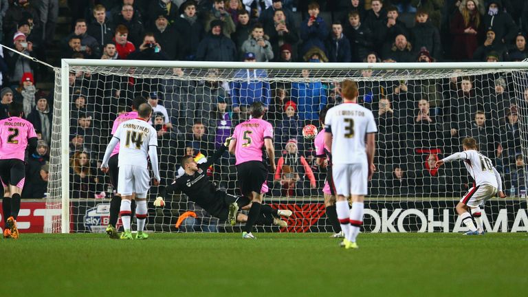 MILTON KEYNES, ENGLAND - JANUARY 19:  Ben Reeves of MK Dons scores from the penalty spot during The Emirates FA Cup third round replay match between Milton