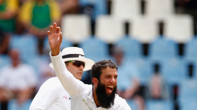 Moeen Ali of England celebrates taking the wicket of Dean Elgar of South Africa during day one of the 4th Test