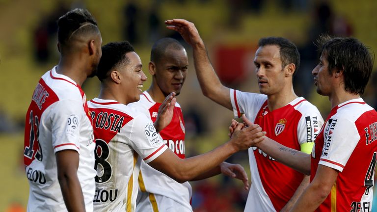 Monaco's Portuguese midfielder Helder Costa (2nd L) celebrates with teammates after scoring a goal during the 