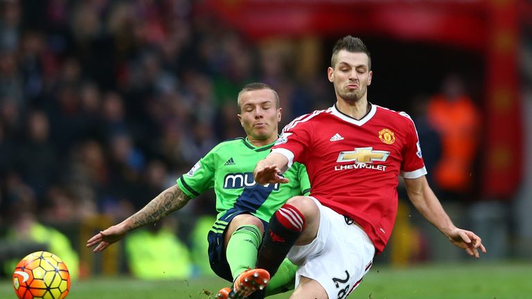 Morgan Schneiderlin of Manchester United and Jordy Clasie of Southampton crunch into a tackle
