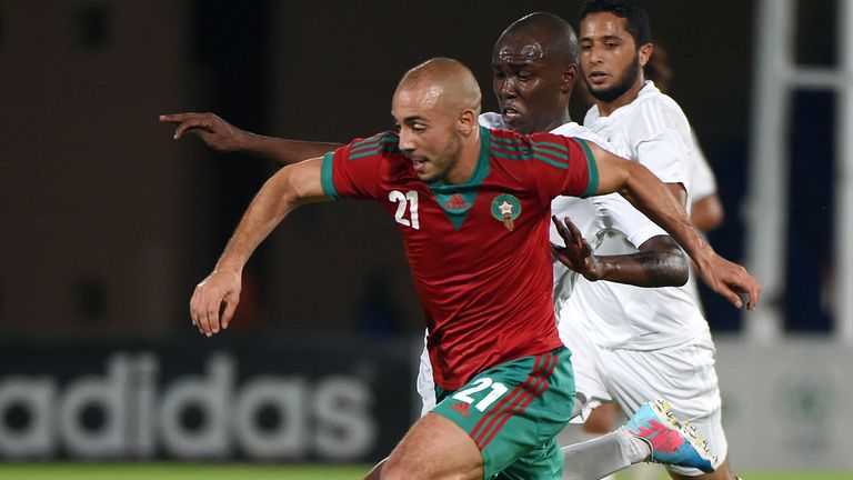 Morocco's Nordin Amrabat (L) challenges Libya's Al-Mutasem Mohammed during a friendly match between Morocco and Libya