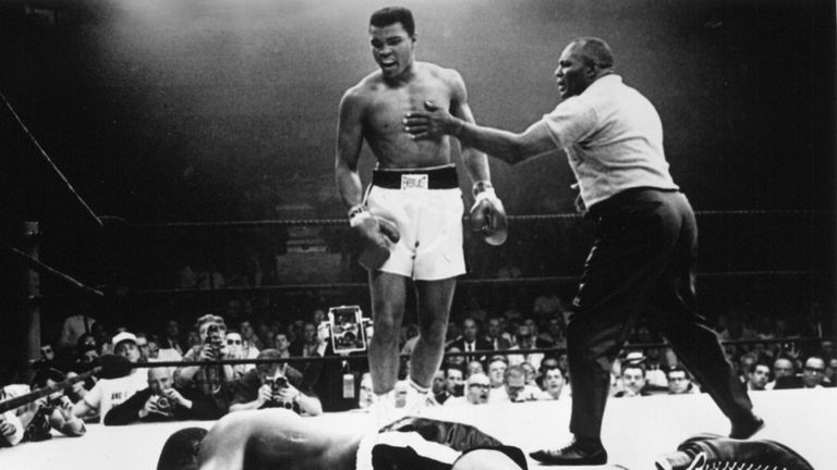 25 MAY 1965:  CASSIUS CLAY OF THE UNITED STATES STANDS OVER THE PRONE FIGURE OF HEAVYWEIGHT CHAMPION SONNY LISTON DURING THEIR BOUT HELD IN LEWISTON, MAINE