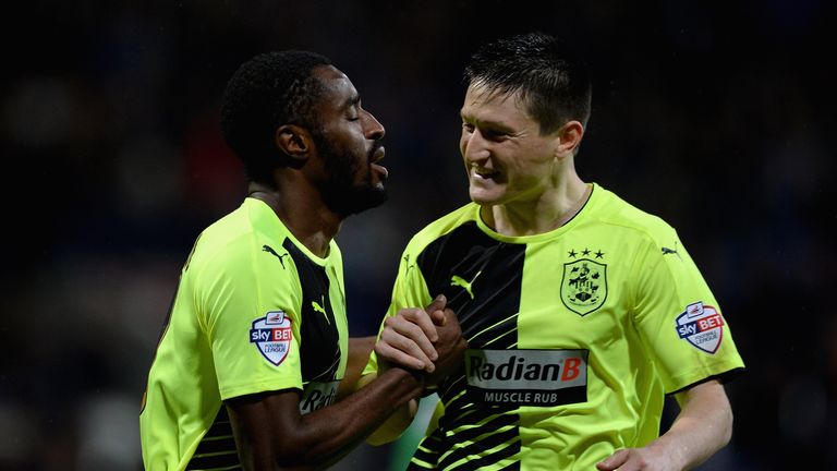 Mustapha Carayol of Huddersfield  celebrates scoring his team's second goal with Joe Lolley, scorer of the first