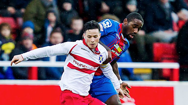 Nat Wedderburn of Inverness battles with Stirling Albion's William Robertson (front) 