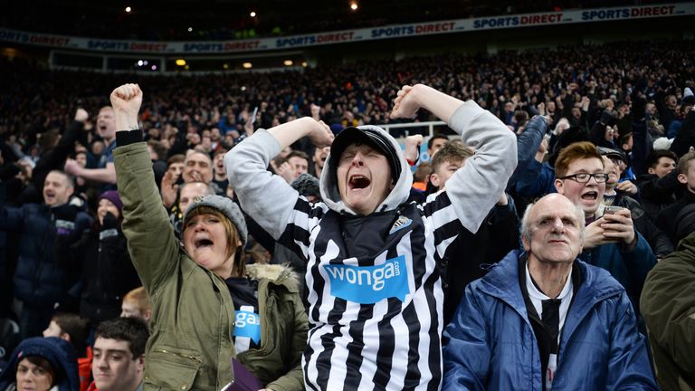 Newcastle United fans celebrate as Aleksandar Mitrovic scores their second and equalising goal against Manchester United