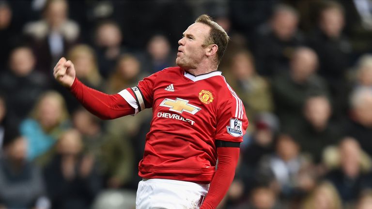 Wayne Rooney of Manchester United celebrates as he scores their third goal against Newcastle