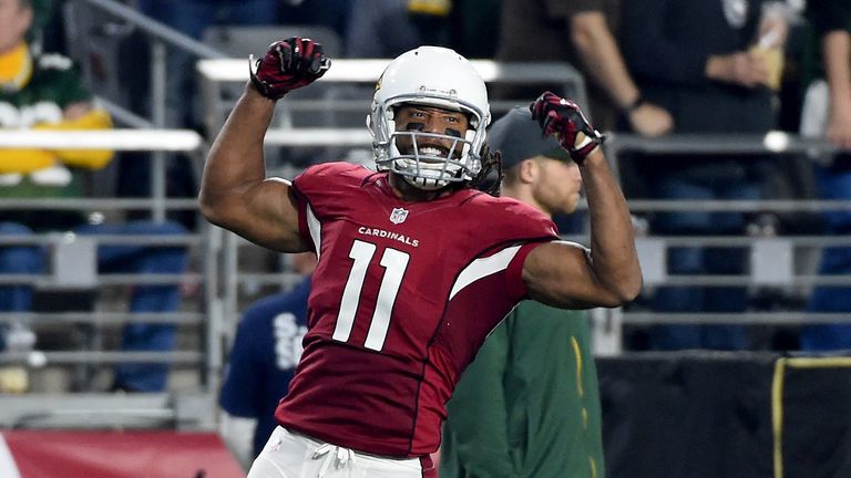Wide receiver Larry Fitzgerald of the Arizona Cardinals reacts after making a catch against Green Bay