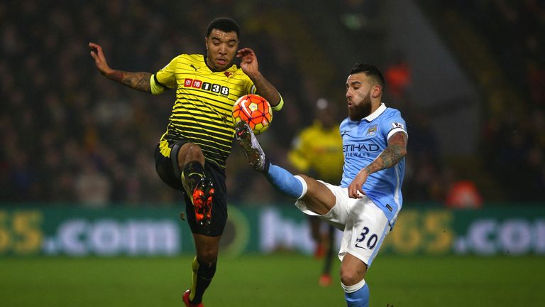 Troy Deeney of Watford (L) battles for the ball with Nicolas Otamendi of Manchester City during the Barclays Premier League match in January 2016