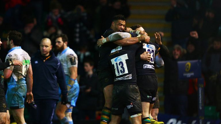 Harry Mallinder is congratulated by his Northampton team-mates after scoring the match-winning try