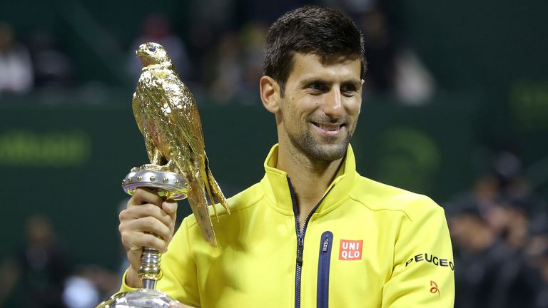 Novak Djokovic of Serbia poses with the Qatar Open  trophy