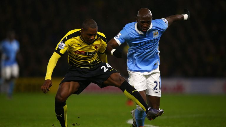 Odion Ighalo of Watford (L) battles for the ball with Eliaquim Mangala of Manchester City during the Premier League match at Vicarage Road in January 2016