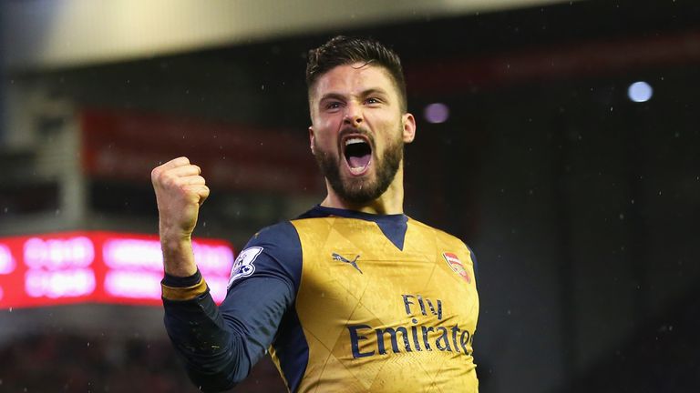 Olivier Giroud celebrates scoring Arsenal's third goal against Liverpool at Anfield