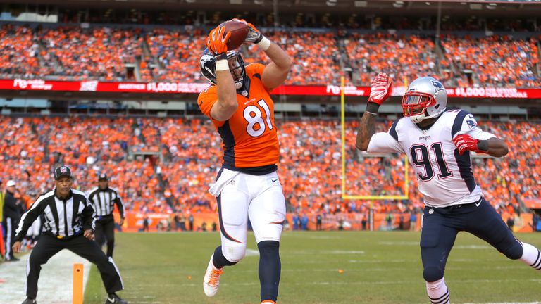 Owen Daniels #81 of the Denver Broncos catches a 12-yard touchdown pass in the second quarter against Jamie Collins #91 of the New England Patriots